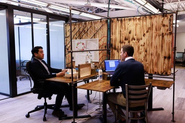 members talking across desk