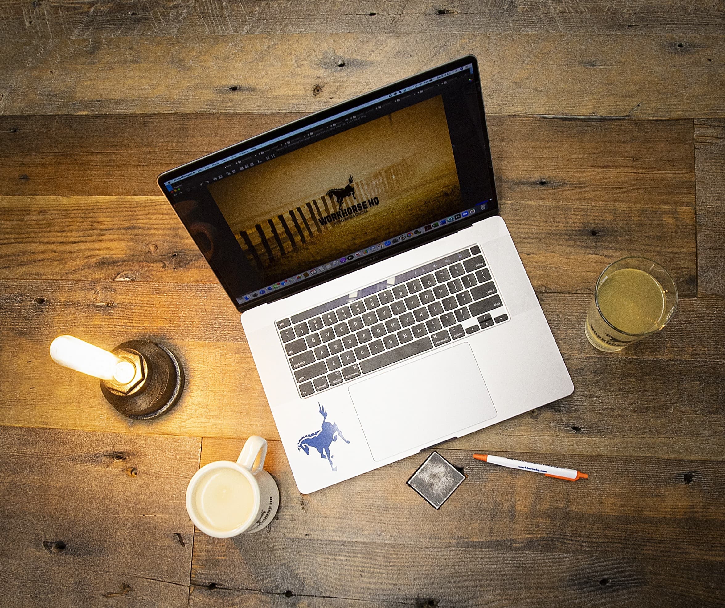 computer on top of dedicated desk with coworking tools