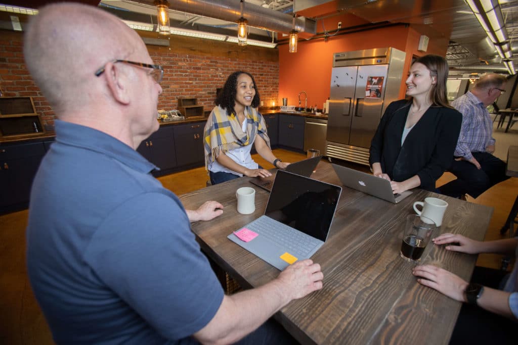Individuals coworking in the Workhorse kitchen
