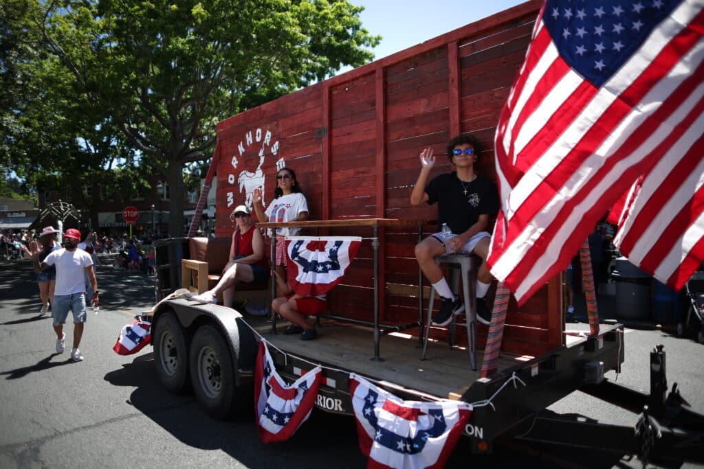 Kids Sitting on the workhorse float in the Edmonds Parade.