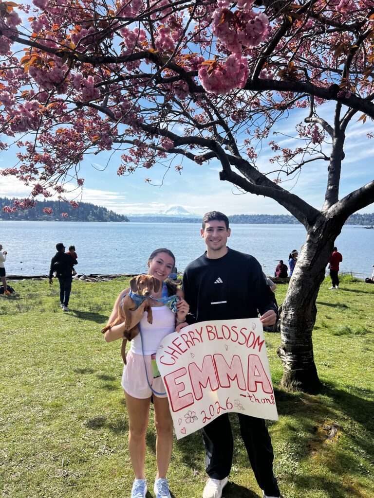 emma with her dog and fiance ready to run